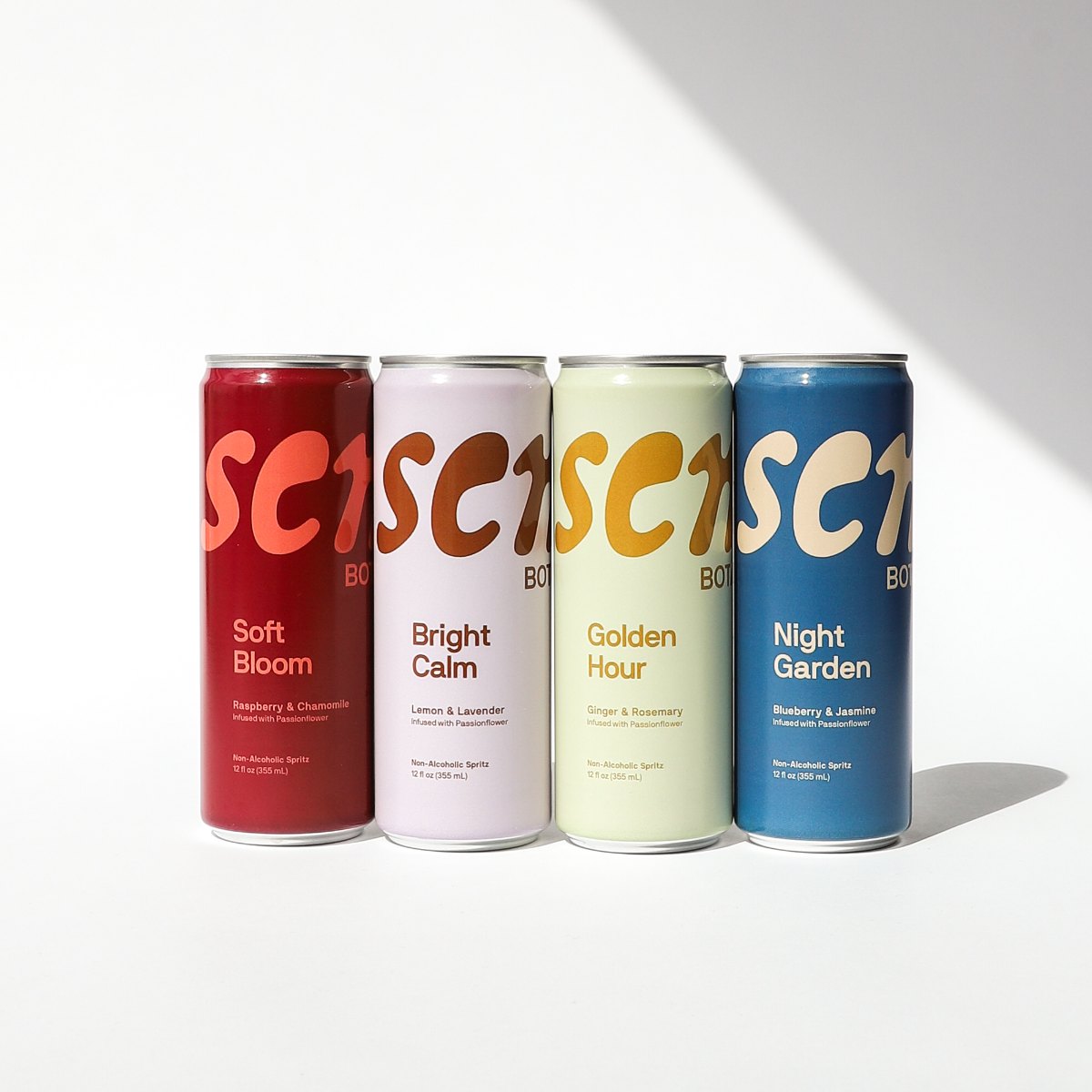 The four Sens Botanicals blends lying on a diagonal in sunlight