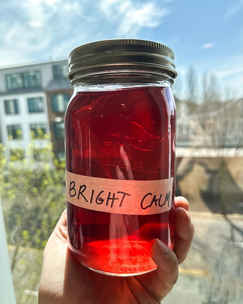 An early Bright Calm trial batch in a hand-labelled jar